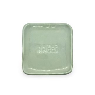Handmade ceramic coaster in blue-green color